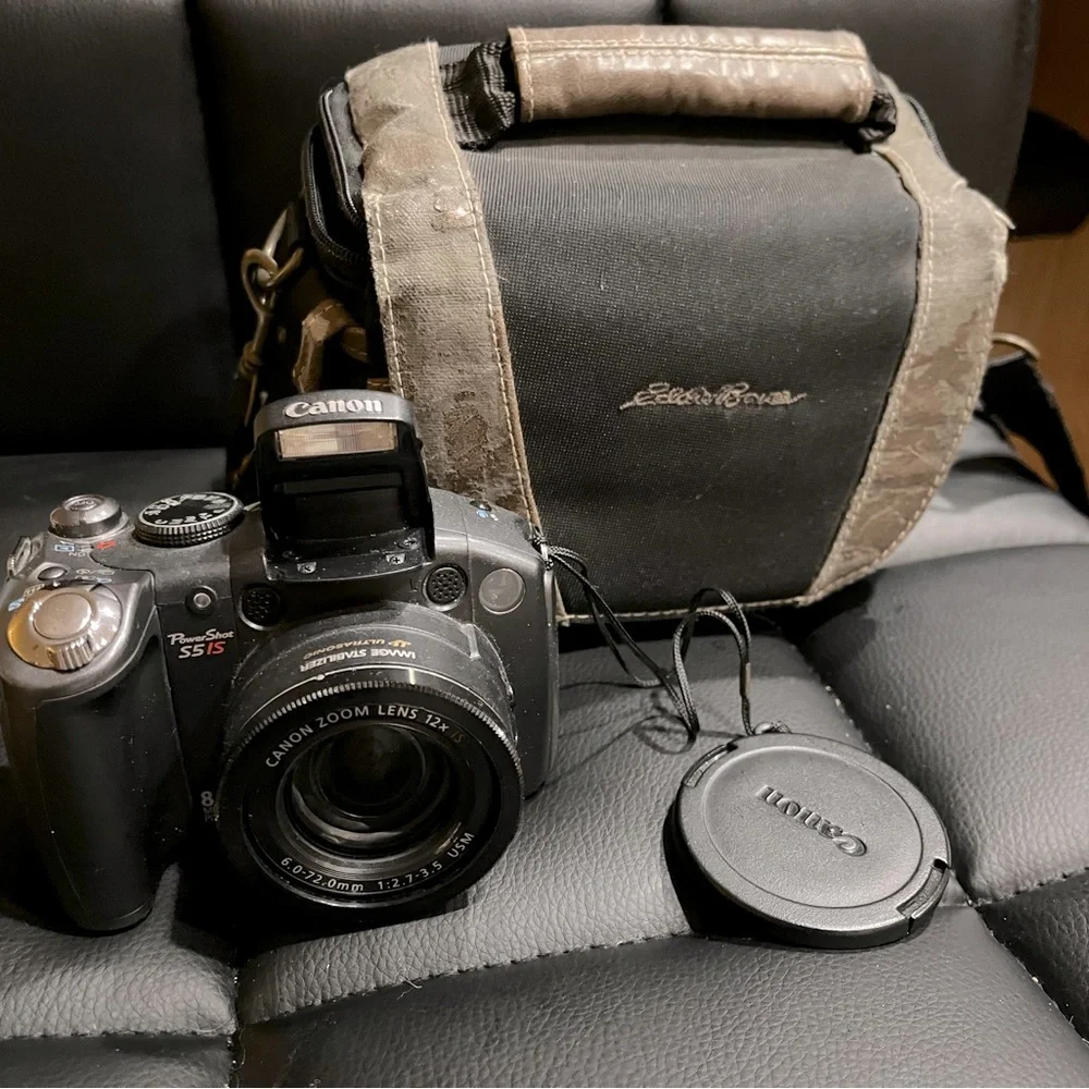 canon powershot s5 is with 2 lens covers and bag